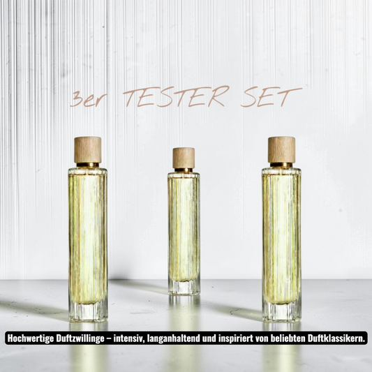 eyfel 3er Parfüm Tester-Set mit drei eleganten Glasflakons und Holzverschluss auf einem Marmortisch